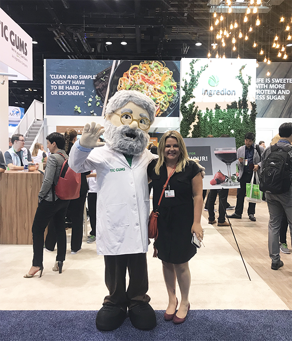 Miranda with trade show booth mascot