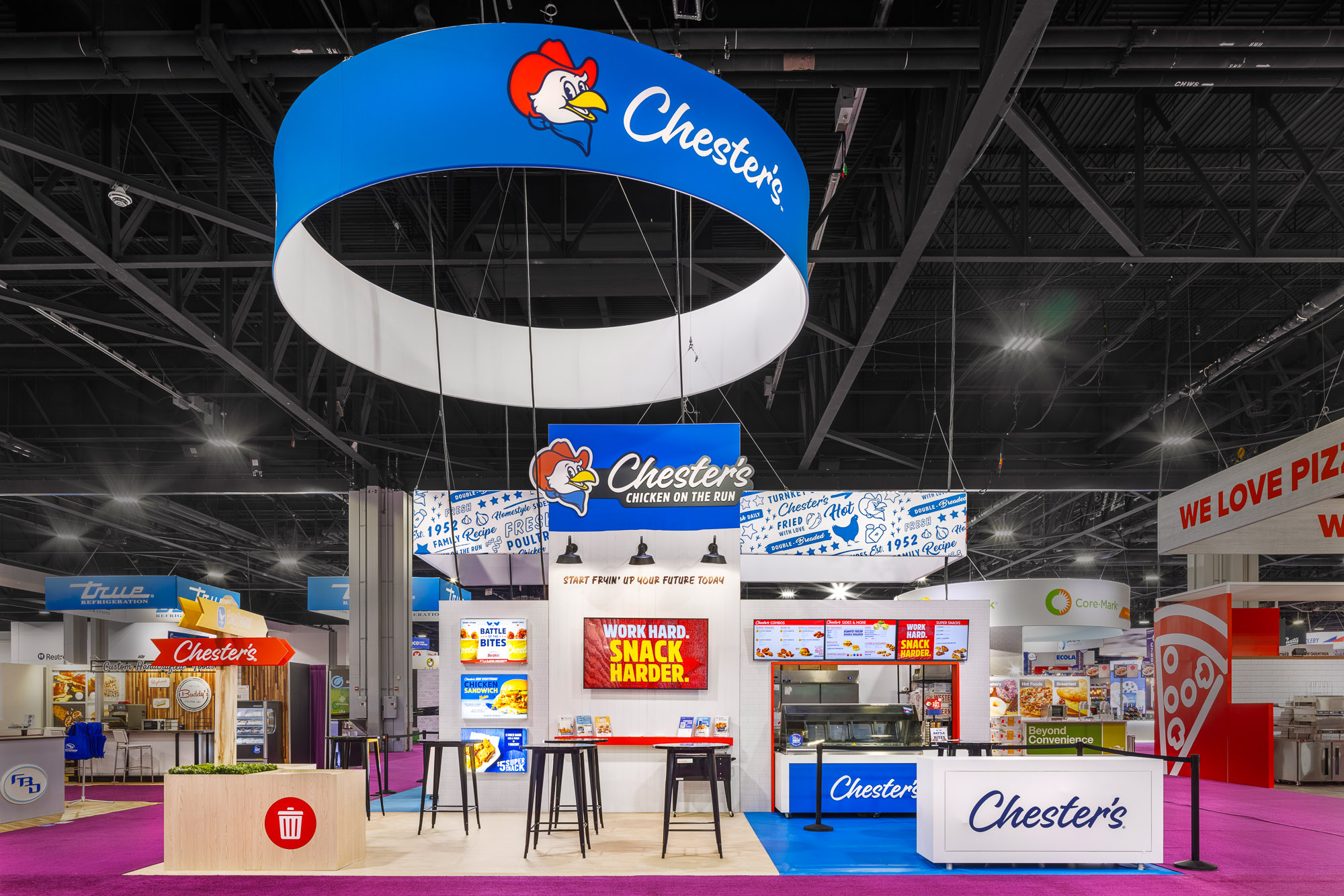 Chester's Chicken booth angled view with kitchen and sampling counters