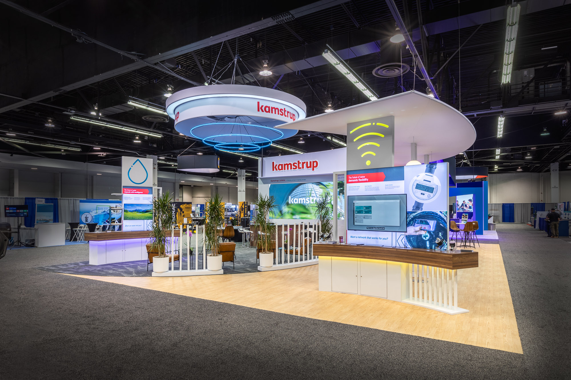 Kamstrup booth overhead circular structure with brand signage