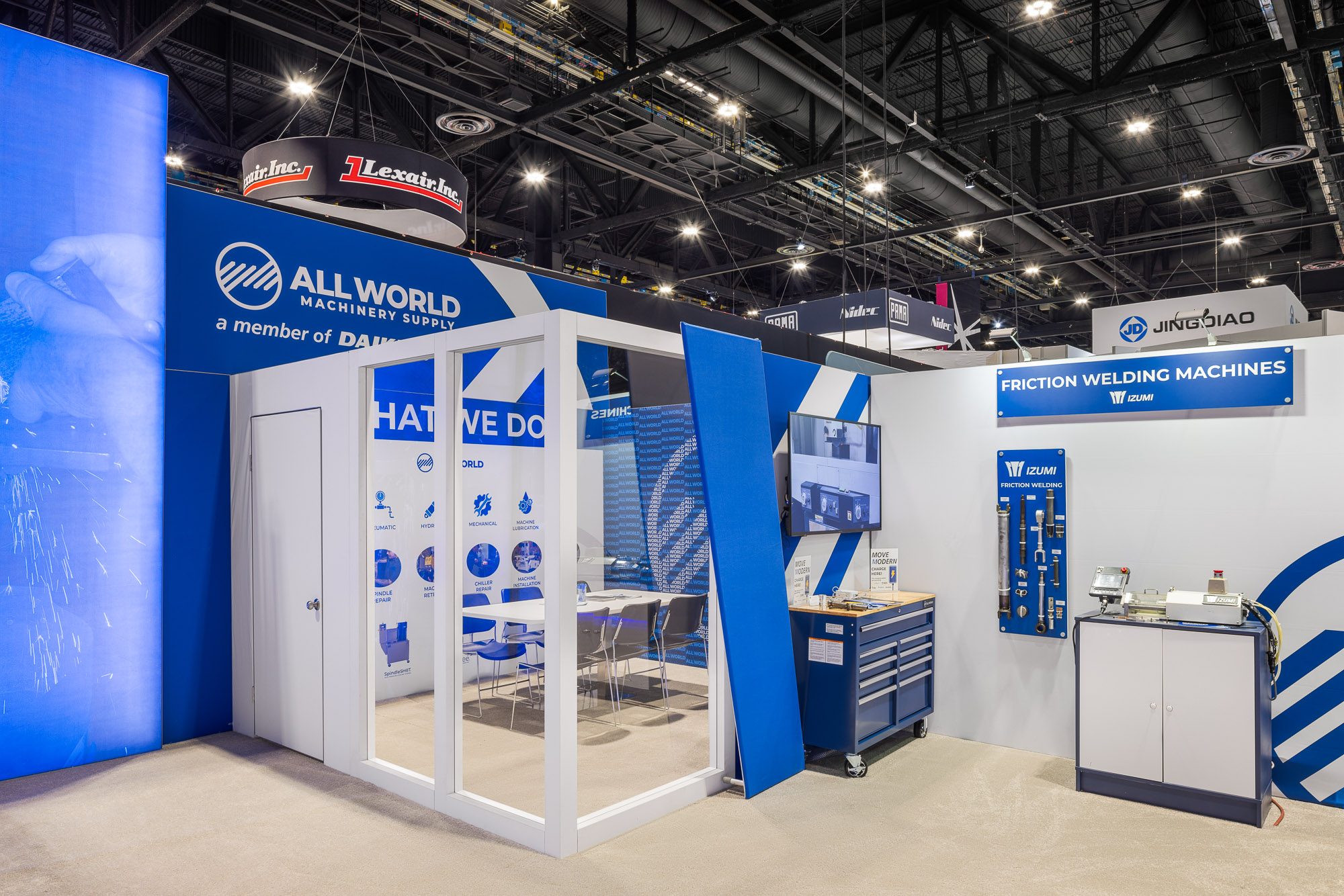 All World Machinery booth close-up showing machine tool showcase and product graphics